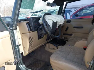 2002 Jeep Wrangler Sport with VIN 1J4FA49S62P743771, listed as a IAAI auction lot 41791205 with 186,622 mi miles. Bid and sale history available at carsss.com. Image 5.
