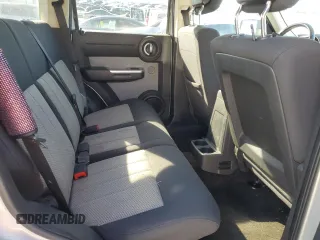 2010 Dodge Nitro SXT z VIN 1D4PT5GKXAW108802, wystawiony jako Copart lot #80215434 z przebiegiem 225 908 mil mil oraz Szkody całkowita. Historia ofert i sprzedaży dostępna na DreamBid. Obrazek 11.