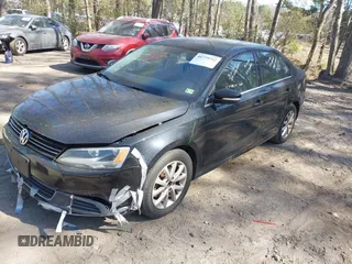 2013 Volkswagen Jetta SE with VIN 3VWDX7AJ5DM375119, listed as a IAAI auction lot 41779752 with 149,943 mi miles and . Bid and sale history available at DreamBid. Image 2.