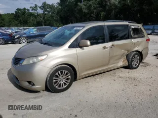 2014 Toyota Sienna XLE with VIN 5TDYK3DC8ES457257, listed as a Copart auction lot 65462385 with 259,699 mi miles and Salvage title. Bid and sale history available at DreamBid. Image 1.