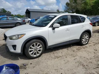 2013 Mazda CX-5 Grand Touring with VIN JM3KE2DE9D0132490, listed as a Copart auction lot 52002555 with 120,573 mi miles and Salvage Title. Bid and sale history available at carsss.com. Image 1.