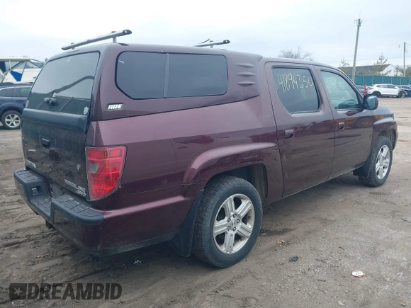 2011 Honda Ridgeline RTL with VIN 5FPYK1F51BB007959, listed as a IAAI auction lot 41894350 with 186,926 mi miles. Bid and sale history available at carsss.com. Image 4.