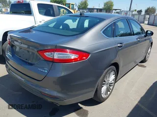 2014 Ford Fusion SE Hybrid with VIN 3FA6P0LU9ER142204, listed as a IAAI auction lot 41964308 with 177,499 mi miles. Bid and sale history available at carsss.com. Image 4.