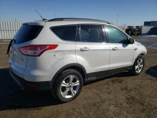 2014 Ford Escape SE z VIN 1FMCU9G9XEUB66869, wystawiony jako Copart lot #59546115 z przebiegiem 224 021 mil mil oraz Szkoda całkowita • Salvage title. Historia ofert i sprzedaży dostępna na DreamBid. Obrazek 3.