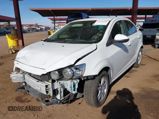 2014 Chevrolet Sonic LT z VIN 1G1JC5SH4E4171516, wystawiony jako IAAI lot #41163056 z przebiegiem 92 362 mil mil oraz . Historia ofert i sprzedaży dostępna na DreamBid. Obrazek 17.