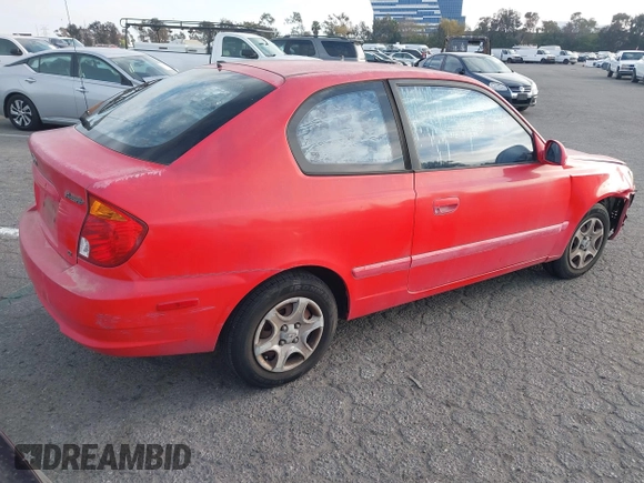 2003 Hyundai Accent GL z VIN KMHCG35C23U238969, wystawiony jako IAAI lot #41462884 z przebiegiem 156 682 mil mil oraz . Historia ofert i sprzedaży dostępna na DreamBid. Obrazek 4.