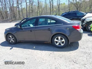 2014 Chevrolet Cruze 1LT z VIN 1G1PC5SB7E7352808, wystawiony jako IAAI lot #42143880 z przebiegiem 111 865 mil mil oraz . Historia ofert i sprzedaży dostępna na DreamBid. Obrazek 14.
