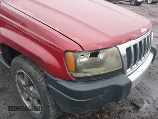 2004 Jeep Grand Cherokee Laredo with VIN 1J4GW48S94C151816, listed as a IAAI auction lot 41983332 with 151,227 mi miles. Bid and sale history available at carsss.com. Image 6.