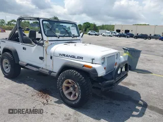 1990 Jeep Wrangler z VIN 2J4FY29T7LJ528844, wystawiony jako IAAI lot #42354175 z przebiegiem 69 349 mil mil oraz . Historia ofert i sprzedaży dostępna na DreamBid. Obrazek 1.