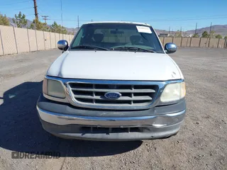 2002 Ford F-150 XL with VIN 1FTRX17W22KE34494, listed as a IAAI auction lot 41689313 with 250,243 mi miles. Bid and sale history available at carsss.com. Image 6.