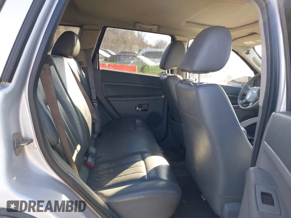 2005 Jeep Grand Cherokee Laredo z VIN 1J4GR48K85C587842, wystawiony jako IAAI lot #41454939 z przebiegiem 108 184 mil mil oraz . Historia ofert i sprzedaży dostępna na DreamBid. Obrazek 8.