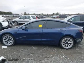 2023 Tesla Model 3 with VIN 5YJ3E1EA7PF446874, listed as a IAAI auction lot 41133303 with 47,748 mi miles. Bid and sale history available at carsss.com. Image 14.