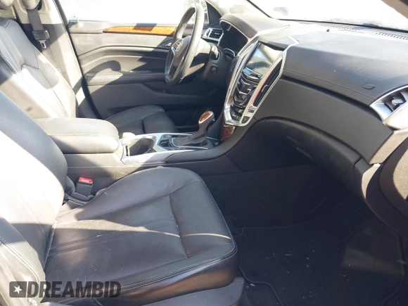 2014 Cadillac SRX Premium Collection z VIN 3GYFNDE34ES581728, wystawiony jako IAAI lot #41578226 z przebiegiem 121 118 mil mil oraz . Historia ofert i sprzedaży dostępna na DreamBid. Obrazek 5.