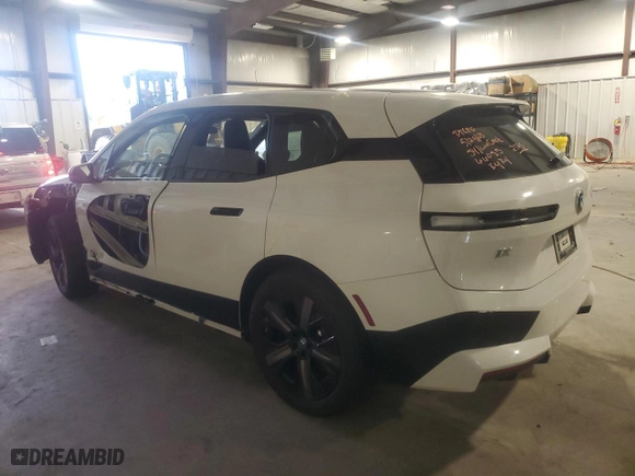 2023 BMW iX xDrive50 with VIN WB523CF0XPCM62725, listed as a Copart auction lot 58658353 with 1,203 mi miles. Bid and sale history available at carsss.com. Image 2.
