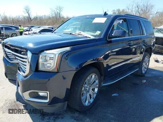 2017 GMC Yukon SLT with VIN 1GKS1BKC9HR356600, listed as a IAAI auction lot 41694218 with 155,855 mi miles. Bid and sale history available at carsss.com. Image 2.