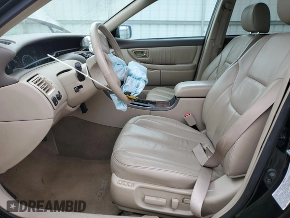 2000 Toyota Avalon XL with VIN 4T1BF28B4YU105732, listed as a Copart auction lot 54752665 with 143,855 mi miles and Salvage Title. Bid and sale history available at DreamBid. Image 7.