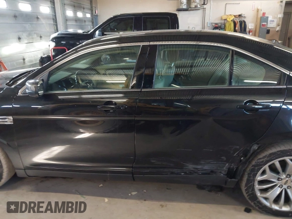 2015 Ford Taurus Limited with VIN 1FAHP2J87FG172580, listed as a IAAI auction lot 41891567 with 183,784 mi miles. Bid and sale history available at carsss.com. Image 14.