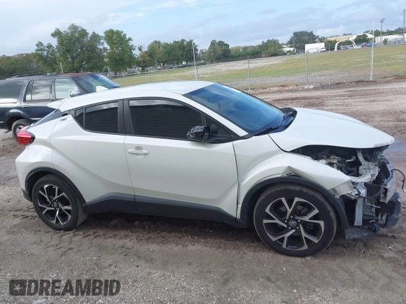 2018 Toyota C-HR XLE with VIN JTNKHMBX3J1010211, listed as a IAAI auction lot 40799443 with 104,148 mi miles. Bid and sale history available at carsss.com. Image 14.