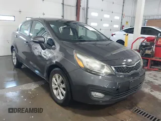 2013 Kia Rio SX with VIN KNADN4A34D6161177, listed as a IAAI auction lot 41273092 with 138,402 mi miles. Bid and sale history available at carsss.com. Image 1.