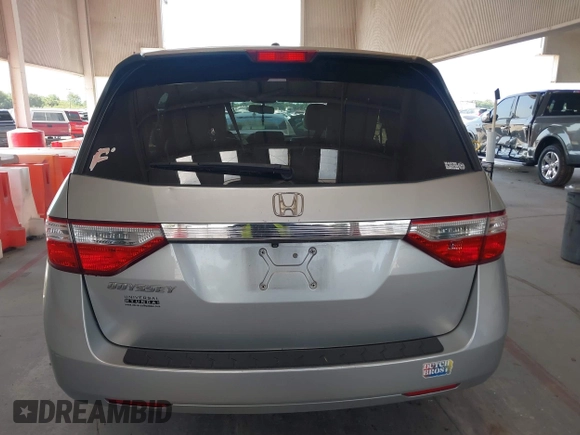 2012 Honda Odyssey EX-L with VIN 5FNRL5H67CB005013, listed as a IAAI auction lot 42295586 with 200,611 mi miles and . Bid and sale history available at DreamBid. Image 16.