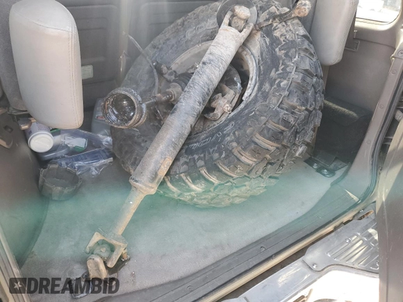 1998 Mitsubishi Montero z VIN JA4MR51R0WJ000921, wystawiony jako Copart lot #56250965 z przebiegiem 181 293 mil mil oraz Szkoda całkowita • Salvage title. Historia ofert i sprzedaży dostępna na DreamBid. Obrazek 13.