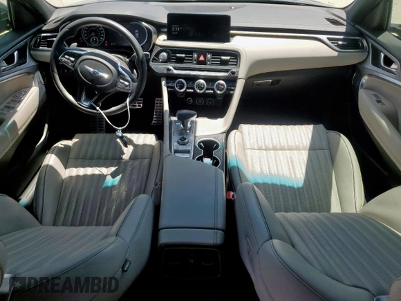 2023 Genesis G70 2.0T with VIN KMTG34TA7PU133747, listed as a Copart auction lot 56338345 with 27,190 mi miles and Salvage title. Bid and sale history available at DreamBid. Image 8.