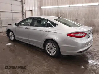 2016 Ford Fusion SE Hybrid z VIN 3FA6P0LU1GR304166, wystawiony jako IAAI lot #41932720 z przebiegiem 68 058 mil mil oraz . Historia ofert i sprzedaży dostępna na DreamBid. Obrazek 3.