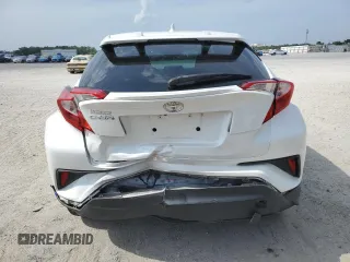2019 Toyota C-HR XLE z VIN NMTKHMBX5KR079425, wystawiony jako Copart lot #57315345 z przebiegiem 109 441 mil mil oraz Szkoda całkowita • Salvage title. Historia ofert i sprzedaży dostępna na DreamBid. Obrazek 6.