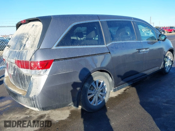 2014 Honda Odyssey EX-L with VIN 5FNRL5H61EB079739, listed as a IAAI auction lot 41659048 with 137,012 mi miles and . Bid and sale history available at carsss.com. Image 4.