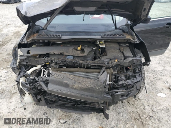 2016 Ford Escape SE z VIN 1FMCU0GX9GUB56962, wystawiony jako Copart lot #57071515 z przebiegiem 150 792 mil mil oraz Szkoda całkowita • Salvage title. Historia ofert i sprzedaży dostępna na DreamBid. Obrazek 12.