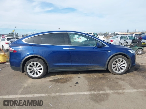 2016 Tesla Model X 70D z VIN 5YJXCAE29GF015890, wystawiony jako IAAI lot #41637564 z przebiegiem 145 848 mil mil oraz . Historia ofert i sprzedaży dostępna na DreamBid. Obrazek 13.