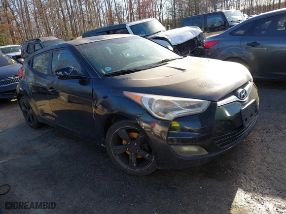 2015 Hyundai Veloster with VIN KMHTC6AD0FU245001, listed as a IAAI auction lot 41881391 with 119,873 mi miles. Bid and sale history available at carsss.com. Image 1.