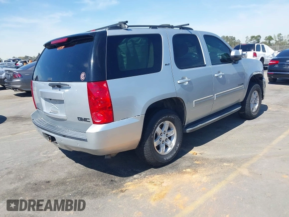 2014 GMC Yukon SLT with VIN 1GKS1CE04ER121301, listed as a IAAI auction lot 41825056 with 141,562 mi miles. Bid and sale history available at carsss.com. Image 4.