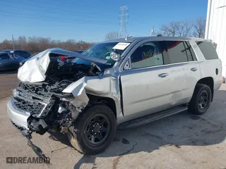 2018 Chevrolet Tahoe Commercial with VIN 1GNSKDEC1JR340887, listed as a IAAI auction lot 41044038 with 99,500 mi miles. Bid and sale history available at carsss.com. Image 2.