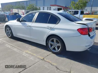 2015 BMW 3 Series 328i with VIN WBA3C1C52FK119339, listed as a IAAI auction lot 41549876 with 148,347 mi miles and . Bid and sale history available at carsss.com. Image 3.