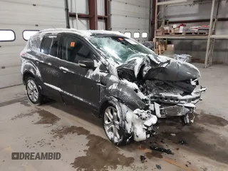 2016 Ford Escape Titanium with VIN 1FMCU9JX1GUB00835, listed as a IAAI auction lot 41371083 with Not provided miles and . Bid and sale history available at DreamBid. Image 1.