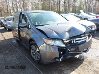 2015 Honda Odyssey Touring Elite z VIN 5FNRL5H9XFB067679, wystawiony jako IAAI lot #41913306 z przebiegiem 199 482 mil mil oraz . Historia ofert i sprzedaży dostępna na DreamBid. Obrazek 6.