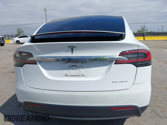 2021 Tesla Model X Long Range Plus with VIN 5YJXCBE23MF321243, listed as a IAAI auction lot 42100580 with 59,878 mi miles and . Bid and sale history available at carsss.com. Image 16.