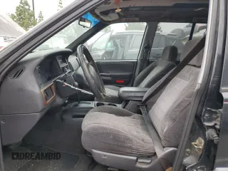 1998 Jeep Grand Cherokee Laredo with VIN 1J4FX58S0WC305329, listed as a Copart auction lot 76777264 with 251,942 mi miles and Clean Title. Bid and sale history available at carsss.com. Image 7.