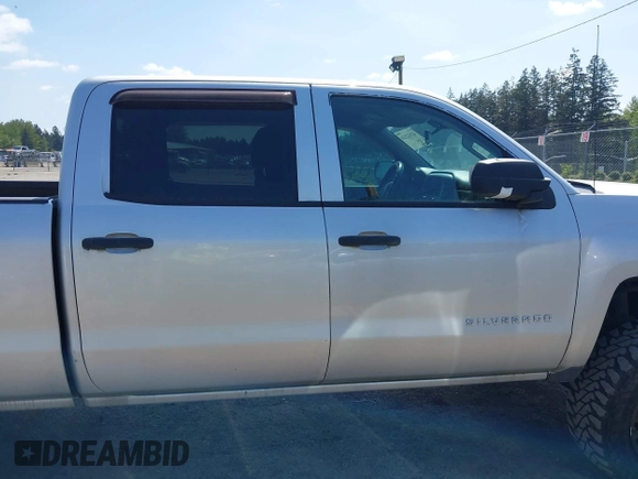 2014 Chevrolet Silverado 1500 LT with VIN 3GCUKREH0EG399090, listed as a IAAI auction lot 42142324 with 104,226 mi miles and . Bid and sale history available at DreamBid. Image 13.