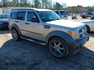 2007 Dodge Nitro SXT with VIN 1D8GT28K97W642118, listed as a IAAI auction lot 41276172 with 385,441 mi miles. Bid and sale history available at carsss.com. Image 1.