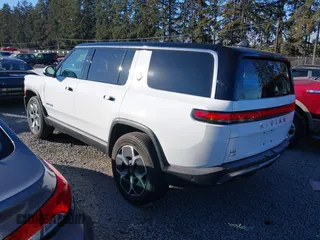 2024 Rivian R1S Adventure with VIN 7PDSGBBA9RN039684, listed as a IAAI auction lot 41558846 with 13,725 mi miles. Bid and sale history available at carsss.com. Image 3.