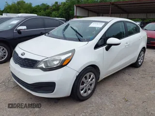 2014 Kia Rio LX with VIN KNADM4A3XE6384733, listed as a IAAI auction lot 42196921 with 153,084 mi miles and . Bid and sale history available at DreamBid. Image 2.