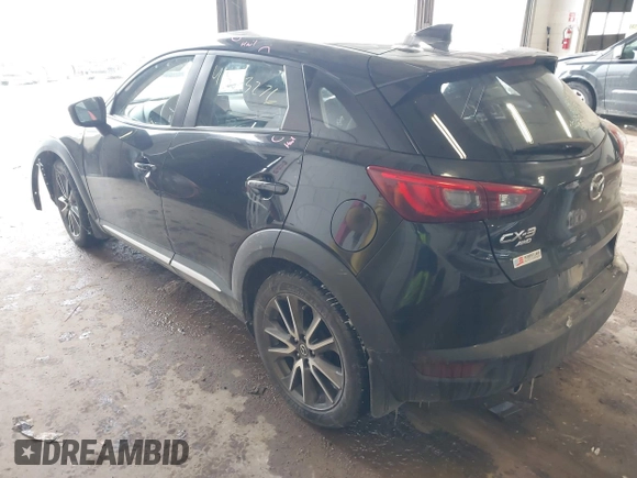 2016 Mazda CX-3 Grand Touring with VIN JM1DKFD71G0132801, listed as a IAAI auction lot 41573276 with 90,000 mi miles. Bid and sale history available at carsss.com. Image 3.