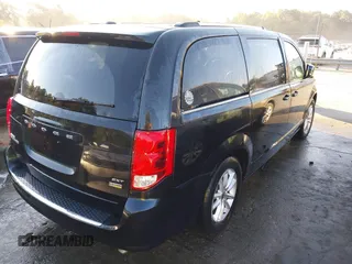 2018 Dodge Grand Caravan SXT with VIN 2C4RDGCG2JR266074, listed as a IAAI auction lot 40545630 with 98,036 mi miles and . Bid and sale history available at DreamBid. Image 4.