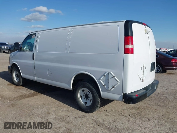 2014 Chevrolet Express Cargo Van with VIN 1GCWGFCAXE1206912, listed as a IAAI auction lot 41700273 with 177,348 mi miles. Bid and sale history available at carsss.com. Image 3.