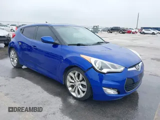 2012 Hyundai Veloster w/Gray Int z VIN KMHTC6AD9CU027053, wystawiony jako IAAI lot #41940277 z przebiegiem 168 195 mil mil oraz . Historia ofert i sprzedaży dostępna na DreamBid. Obrazek 1.