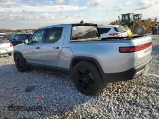 2023 Rivian R1T Adventure with VIN 7FCTGAAA2PN017170, listed as a Copart auction lot 77473014 with 28,821 mi miles and Salvage Title. Bid and sale history available at DreamBid. Image 2.
