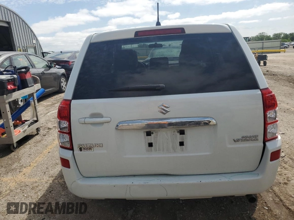 2013 Suzuki Grand Vitara Premium z VIN JS3TE0D62D4100310, wystawiony jako Copart lot #54916065 z przebiegiem 116 428 mil mil oraz Szkoda całkowita • Salvage title. Historia ofert i sprzedaży dostępna na DreamBid. Obrazek 6.