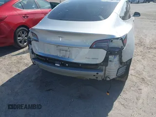 2018 Tesla Model 3 Long Range Battery with VIN 5YJ3E1EB7JF104356, listed as a IAAI auction lot 41936961 with 90,932 mi miles and . Bid and sale history available at DreamBid. Image 6.